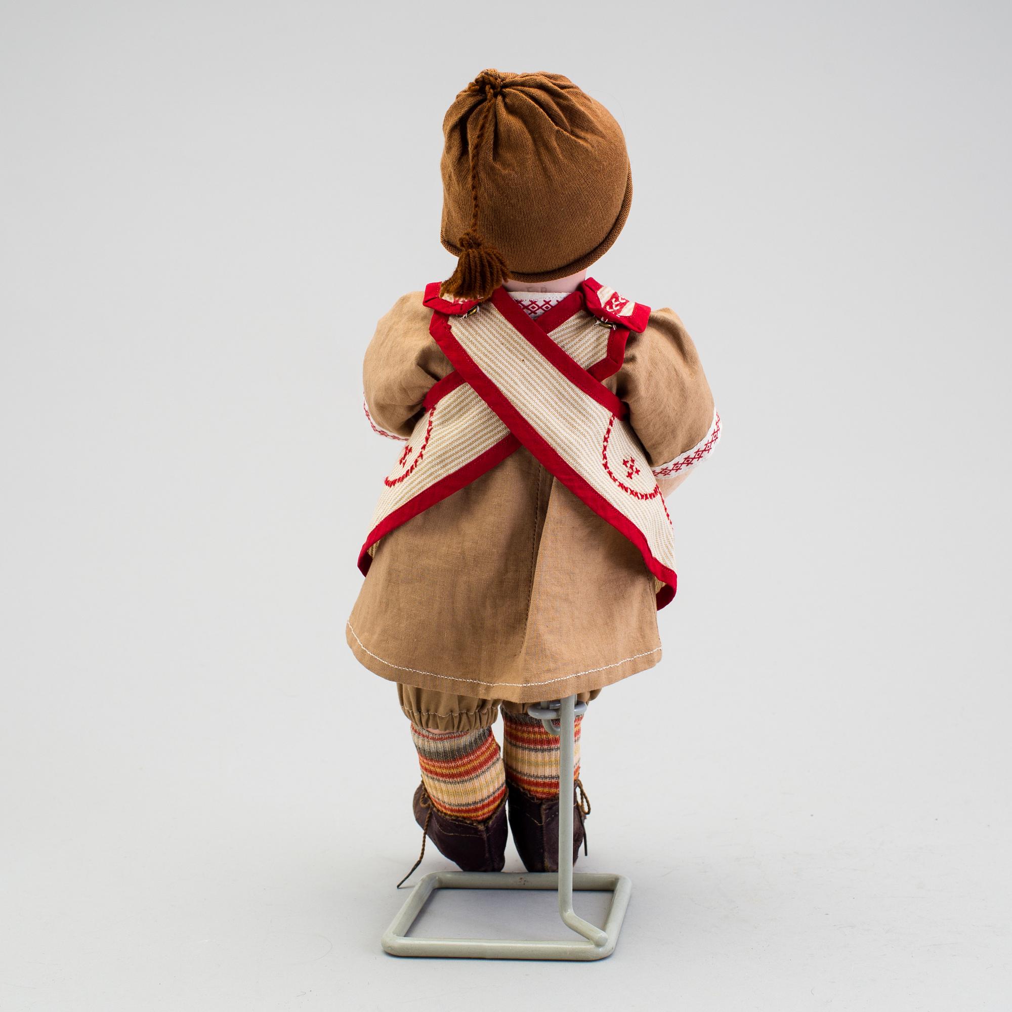 A bisque headed boy doll 235 by S.F.B.J, Paris, France, 1910s.