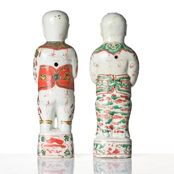 Three Chinese famille verte figures of laughing boys 'Hehe Erxian', 18th century.