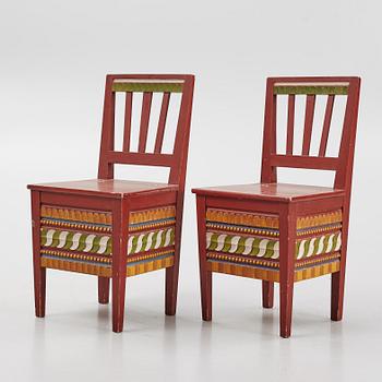 Two polychrome-painted Swedish chairs, 20th century.