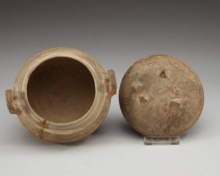 A potted ding tripod censer with cover, Han dynasty (206 BC - 220 AD).