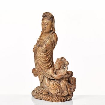 A soapstone sculpture of Guanyin with an attendant, Qing dynasty.