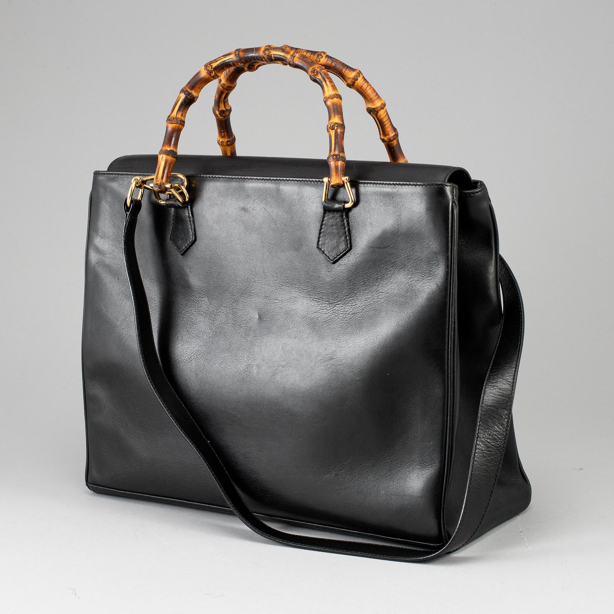GUCCI, a leather bag/briefcase.