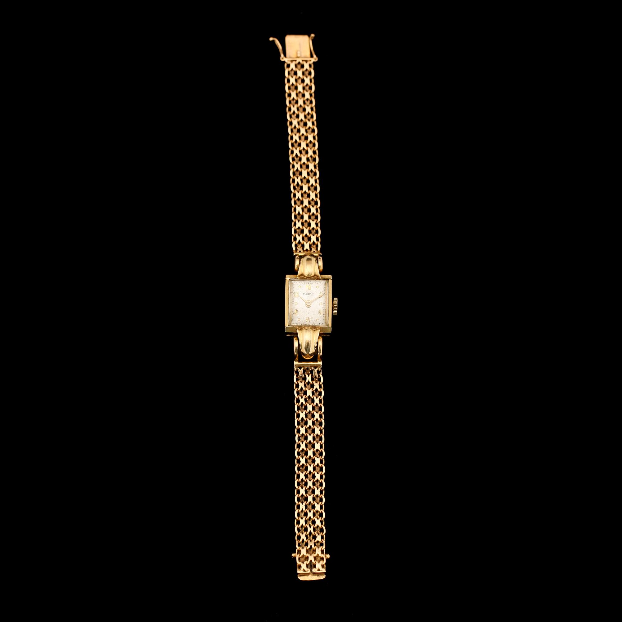 ARMBANDSUR, 18K guld, Marvin, 1900-talets mitt. Total vikt ca 26 g.