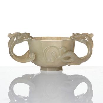 A carved nephrite cup with 'chilong' handles, late Qing dynasty/early 20th century.