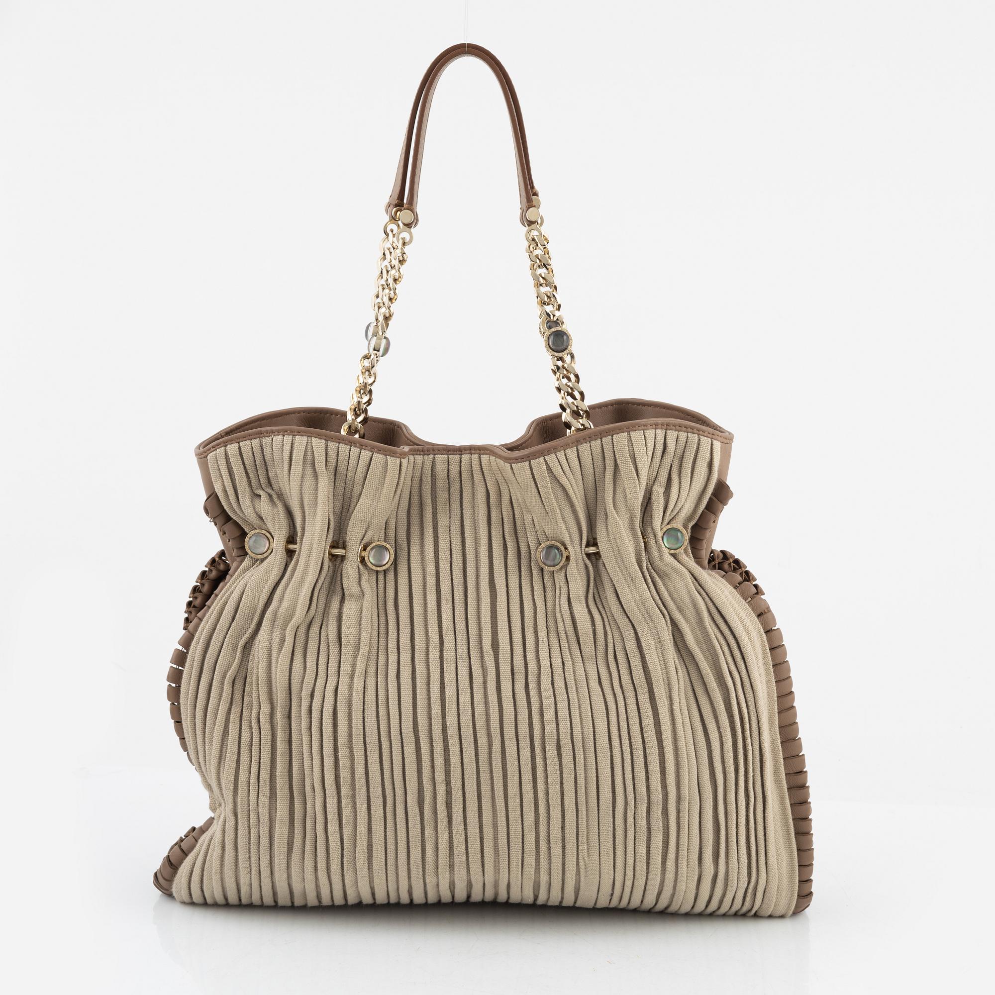 Bulgari, a leather and canvas bag.