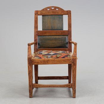 A 19th century folk art armchair.