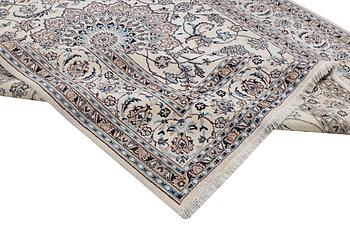 A carpet, Nain, part silk, ca. 345 x 246 cm.