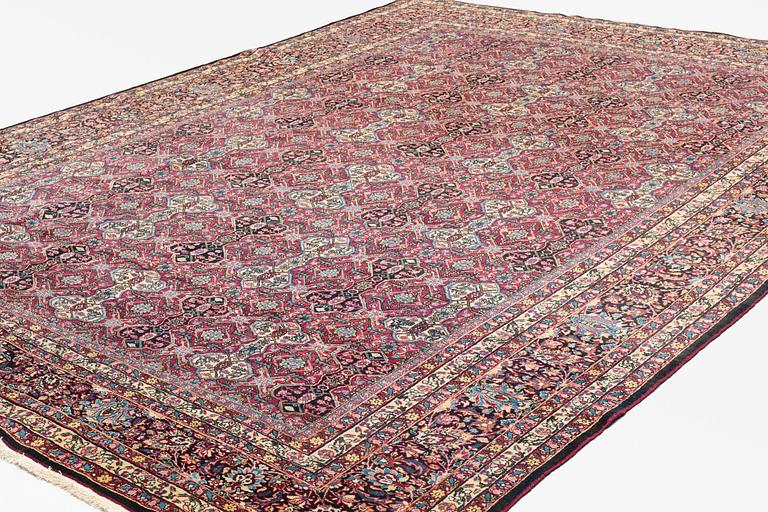 A semi-antique Semnan carpet, North Persia, c. 412 x 304 cm.