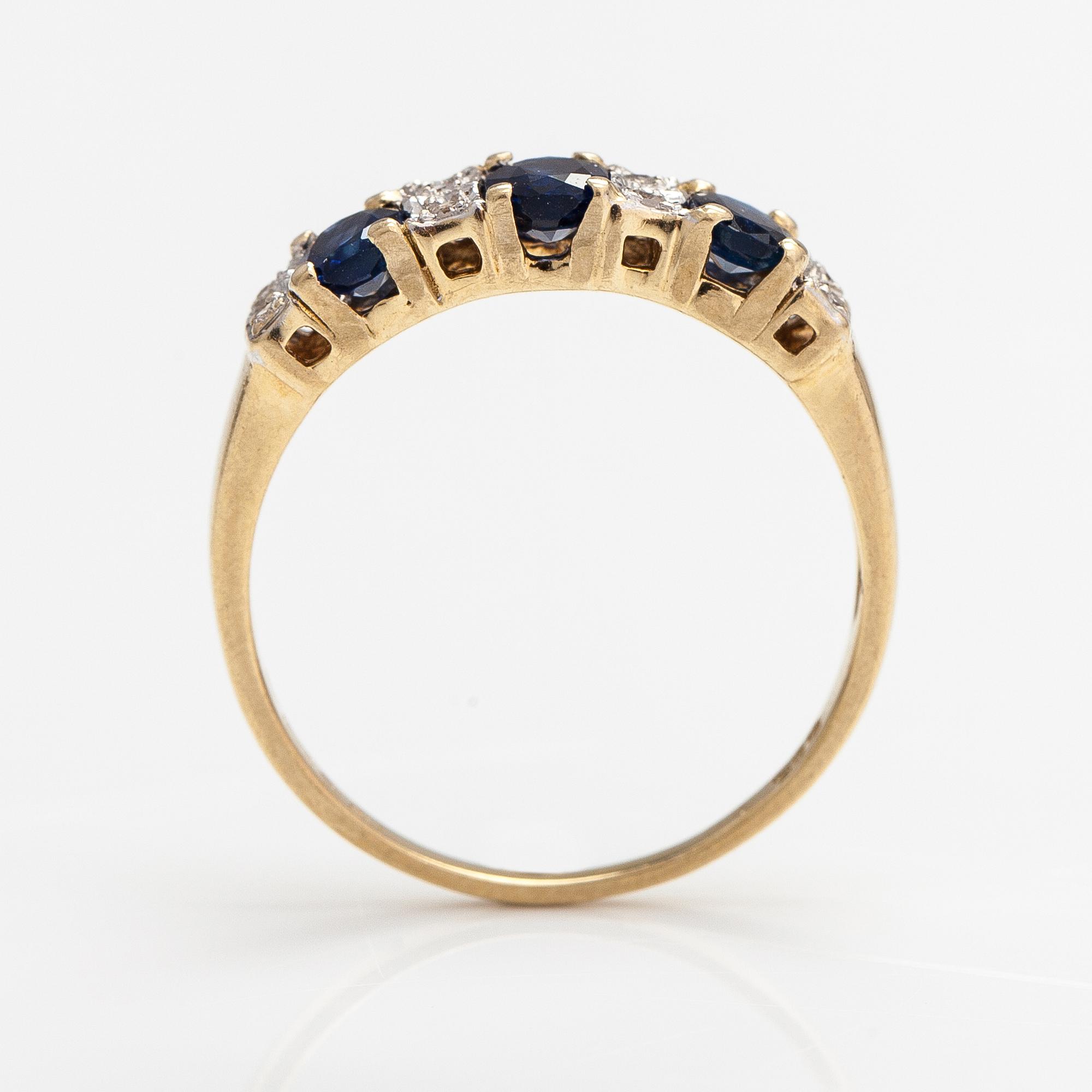 A 14K gold ring with diamonds ca. 0.05 ct and sapphires. Finnish import marks 1990.