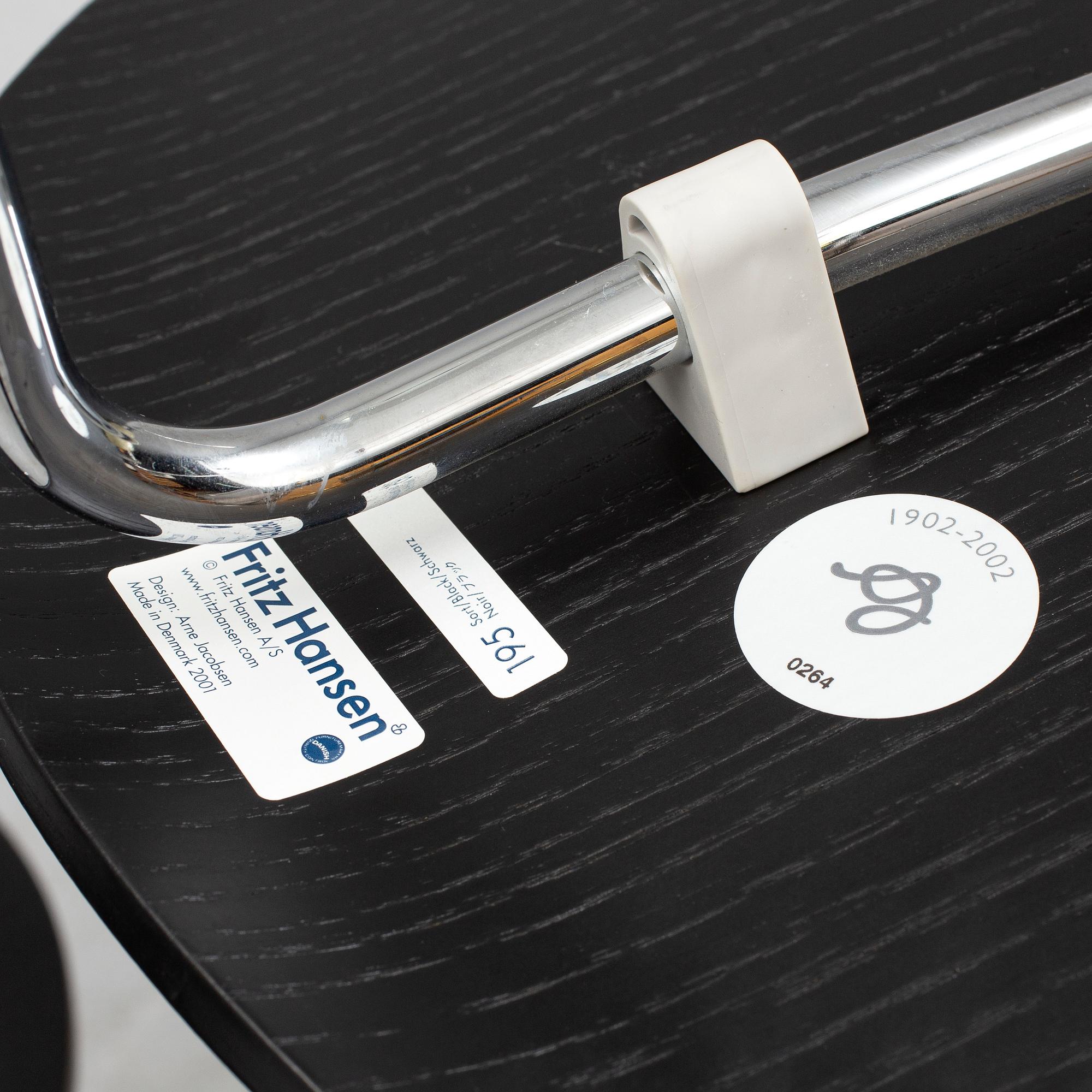 An Arne Jacobsen "Centenary Package" comprising three "Ant Chairs" and an eggshaped table, Fritz Hansen, Denmark.