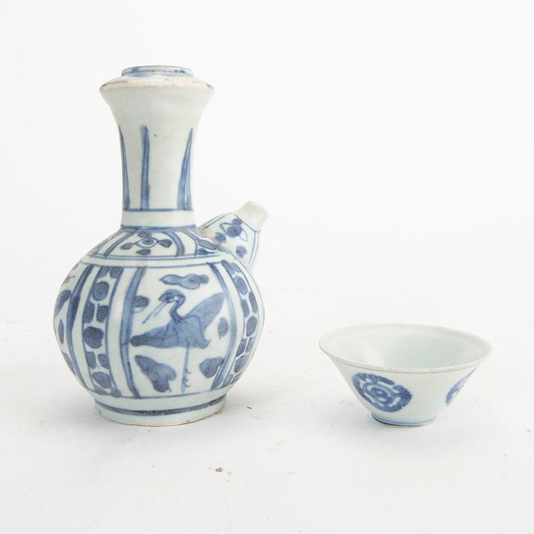 A blue and white kendi and cup, Ming Dynasty.