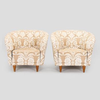 A pair of mid-20th century armchairs.