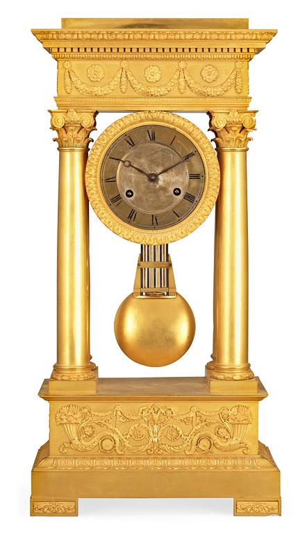 A French Empire early 19th century gilt bronze mantel clock.