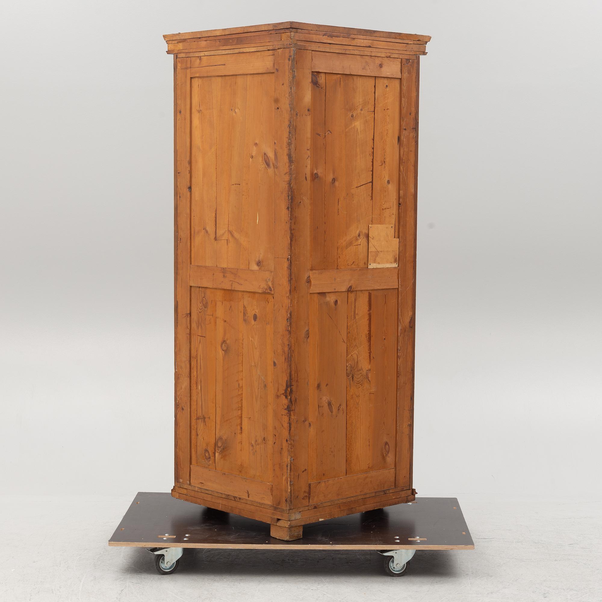 A corner cabinet, circa 1900.