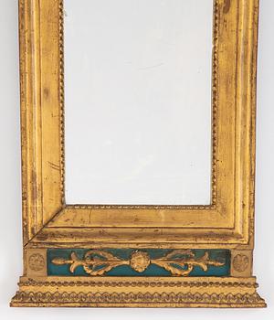 An Empire mirror, first half of the 19th century.