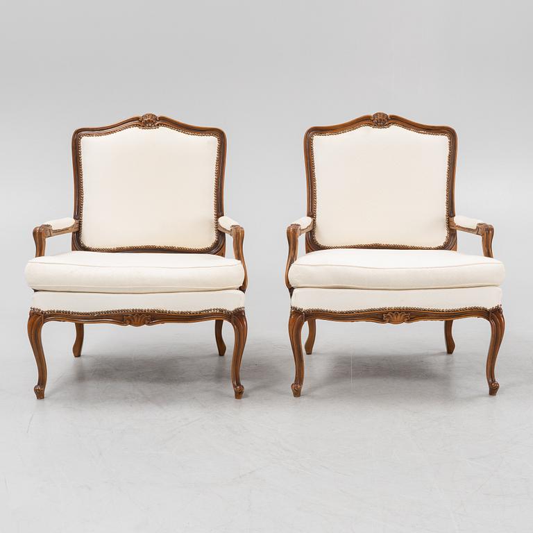A pair of Rococo style armchairs, later part of the 20th century.