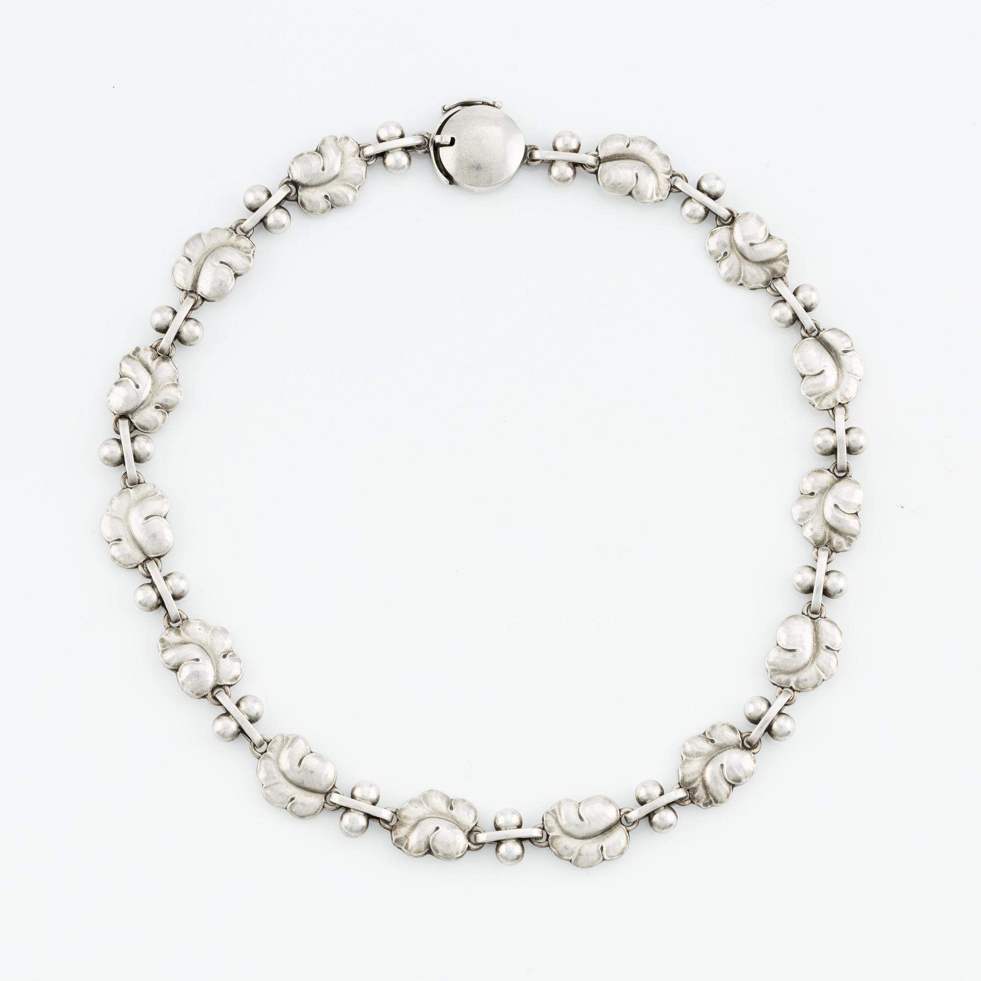 Harald Nielsen, a sterling silver necklace, a brooch, and a pair of earrings, for Georg Jensen, Denmark post 1945.