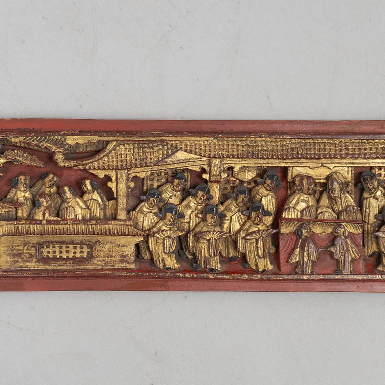 A group of three Chinese wooden panels, late Qing dynasty / around 1900.