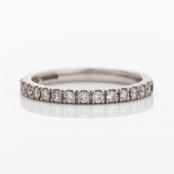 A platinum ring with brilliant cut diamonds.