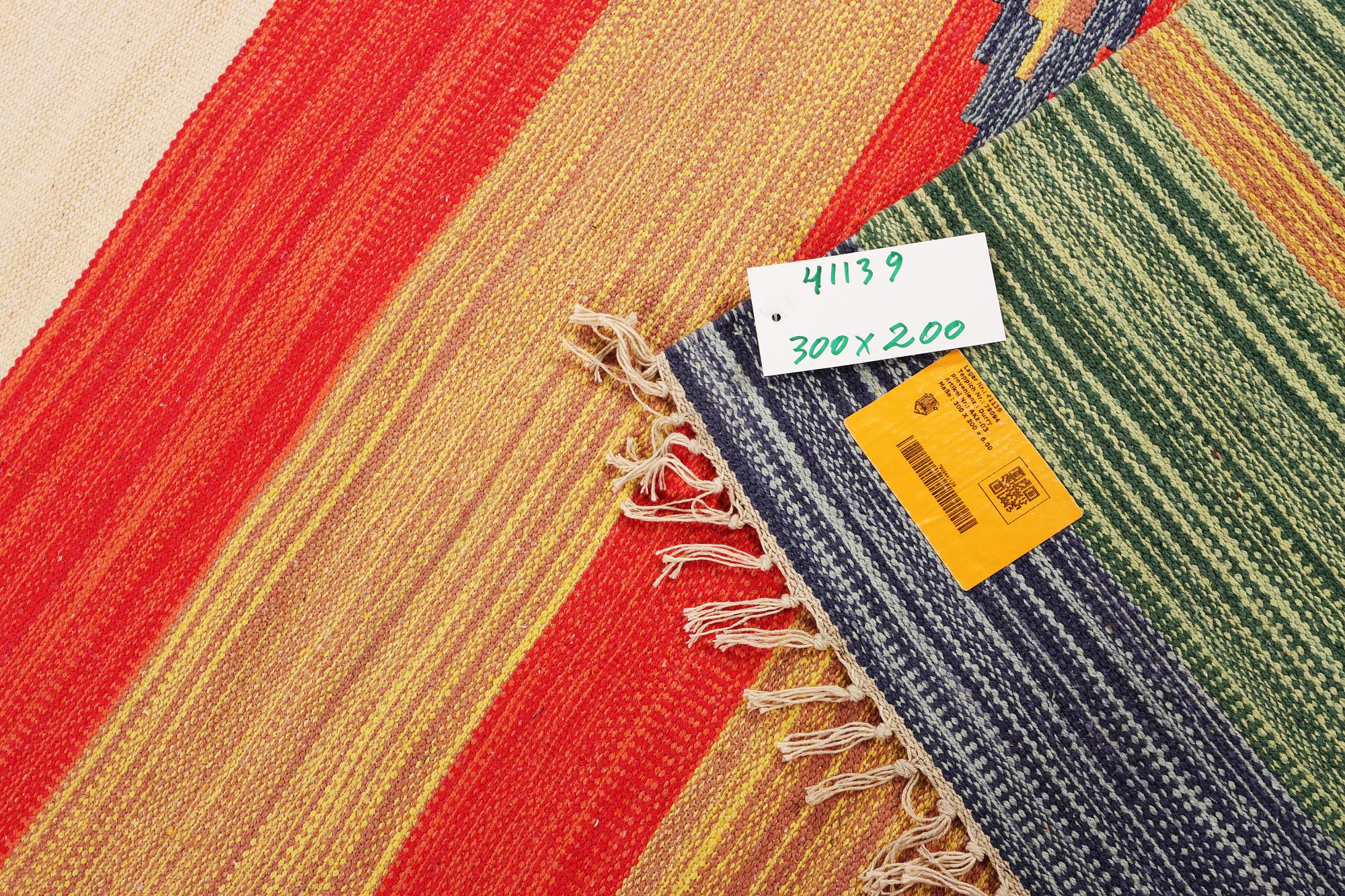 A Durry carpet, c. 300 x 200 cm.