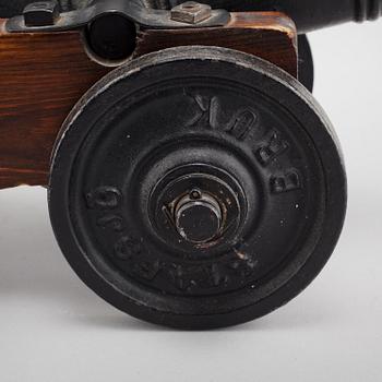 A 20th century salute cannon with wooden gun carriage by Stafsjö Bruk, Sweden.