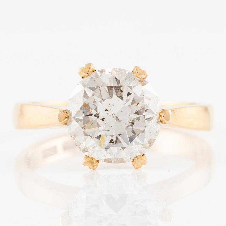 Ring 18K gold with a round brilliant-cut diamond.