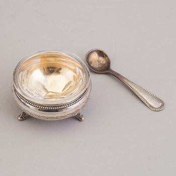 LARS LARSON & CO, 12 parcel-gilt silver and glass salt cellars with spoons, Stockholm, 1876.