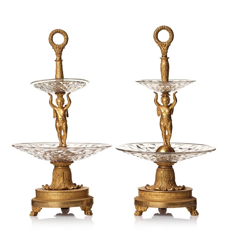 A pair of French Empire early 19th century gilt bronze and glass centre pieces in the manner of Pierre Philippe Thomire.