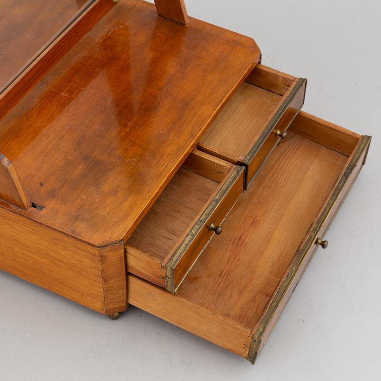 An Empire table mirror, first half of the 19th century.