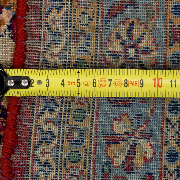 A semi-antique silk Kashan, ca 316 x 205.