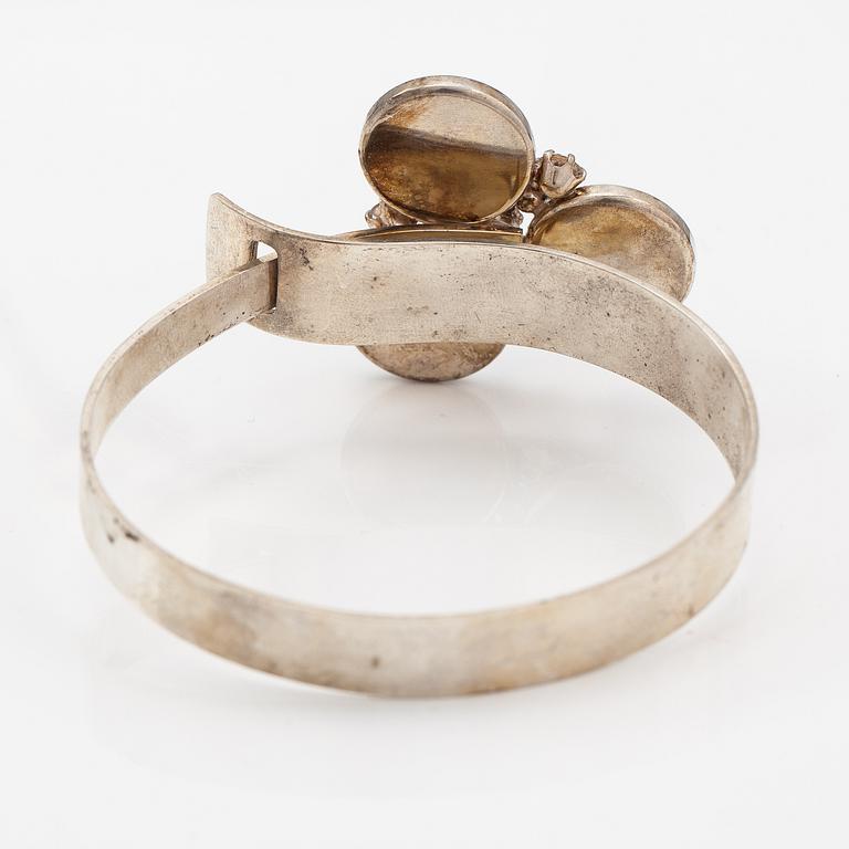 Elis Kauppi, A sterling silver bracelet "Tunturipuro" with spectrolites and rock crystals. Kupittaan kulta, Turku 1960's.