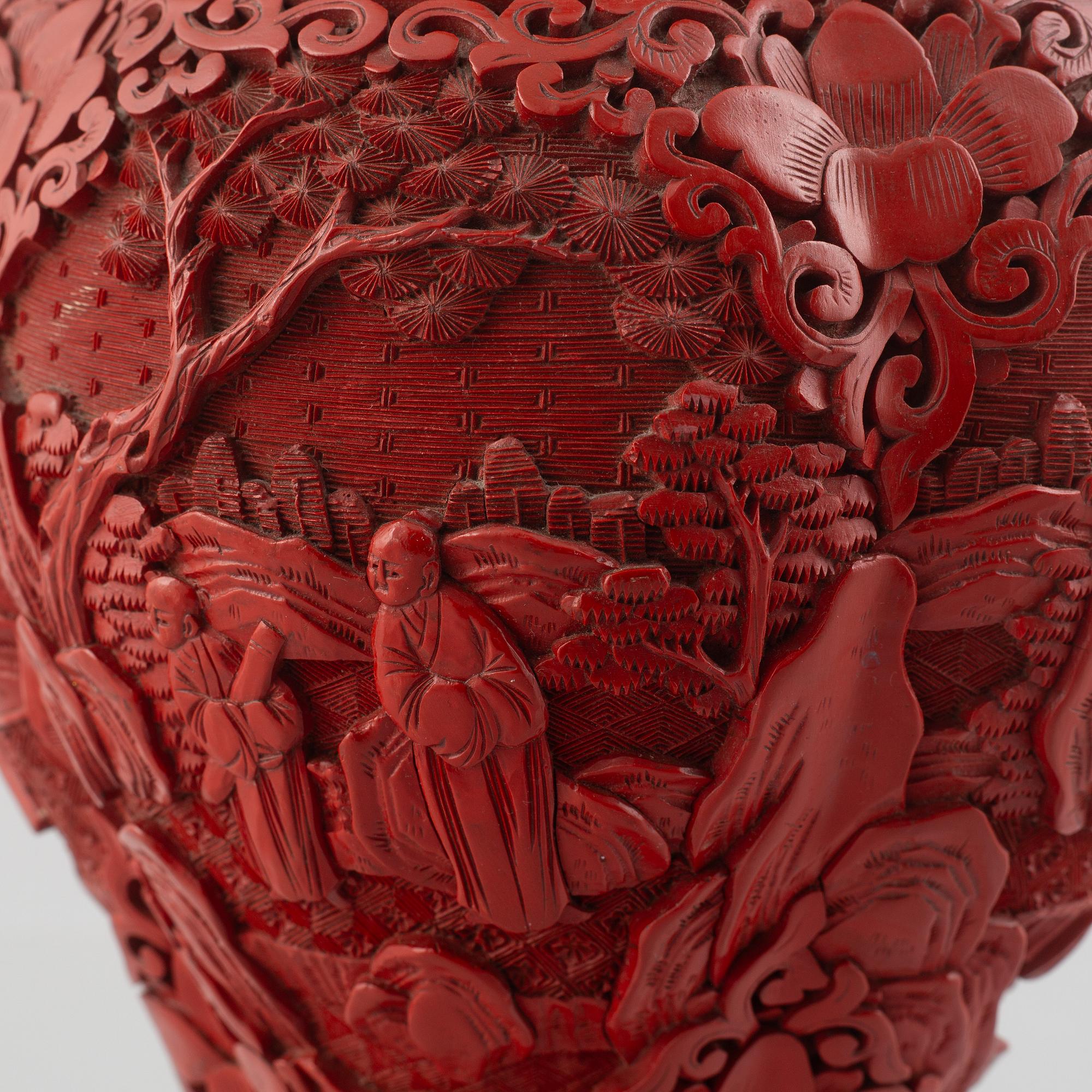 A red laquer vase, early 20th century.