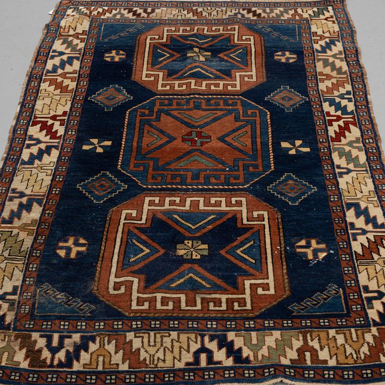 A RUG, a semi-antique Caucasian, ca 175 x 102 cm.