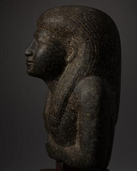 An Egyptian black granite bust of a man, 19th century or older.