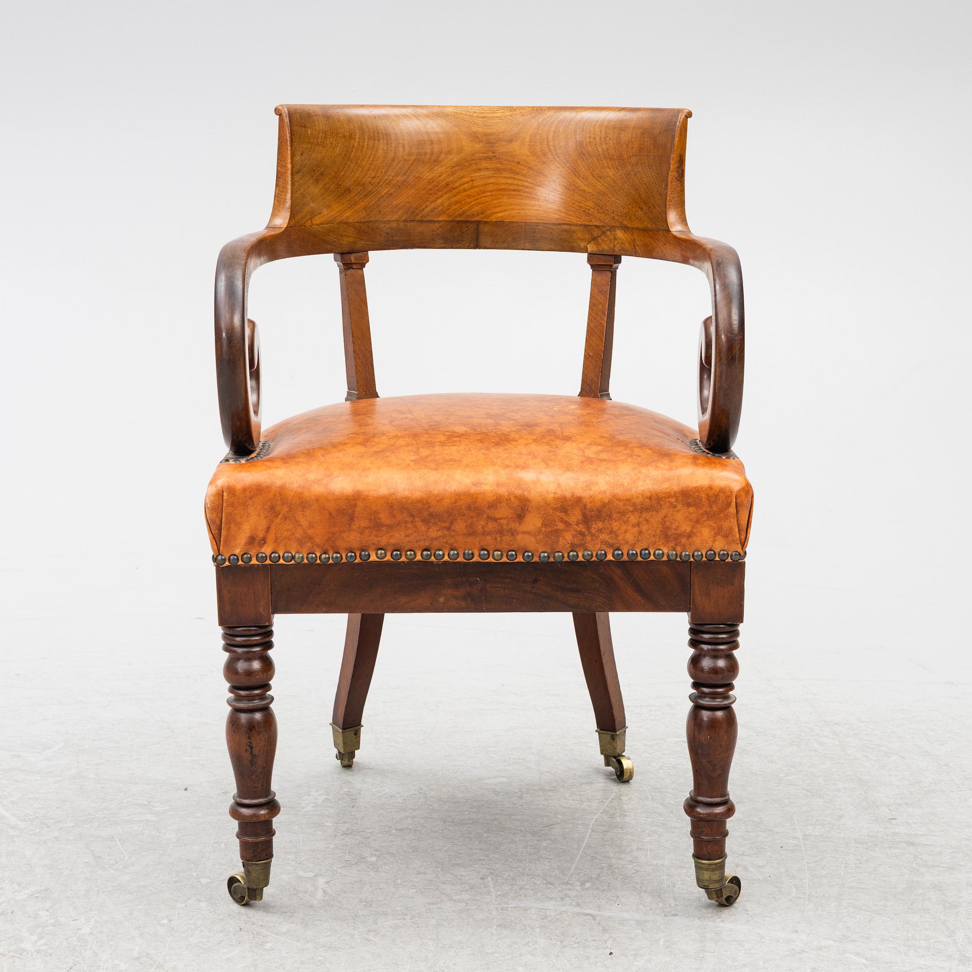 An Empire armchair, 19th century.