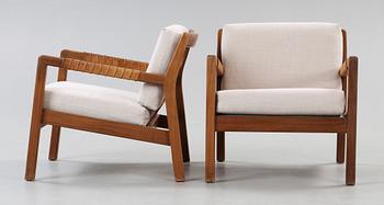 A pair of Carl Gustaf Hiort af Ornäs walnut armchairs, Finland 1950's.