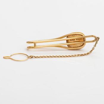 Patek Philippe, Manschettknappar och slipsnål "Ellipse Calatrava", 18K guld och safiglas. Märkta Patek Philippe Geneve.