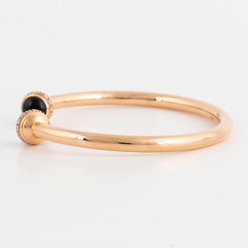 Piaget 18K rose gold, brilliant-cut diamonds and onyx cabochons.