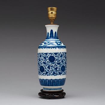 A blue and white vase decorated with lotus-scrolls and bats among clouds, Qing Dynasty, 19th Century.