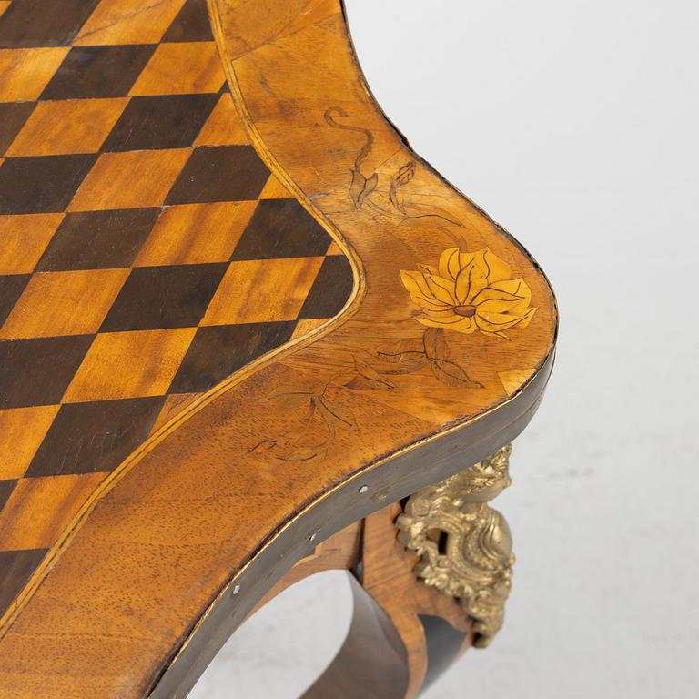 A Louis XV-style games table, early 20th century.