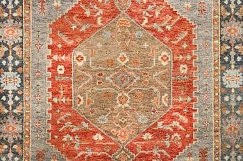 An oriental carpet with Mamluk design, c. 359 x 281 cm.