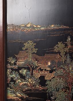 A set of four Chinese lacquer panels with wooden frames, early 20th century.