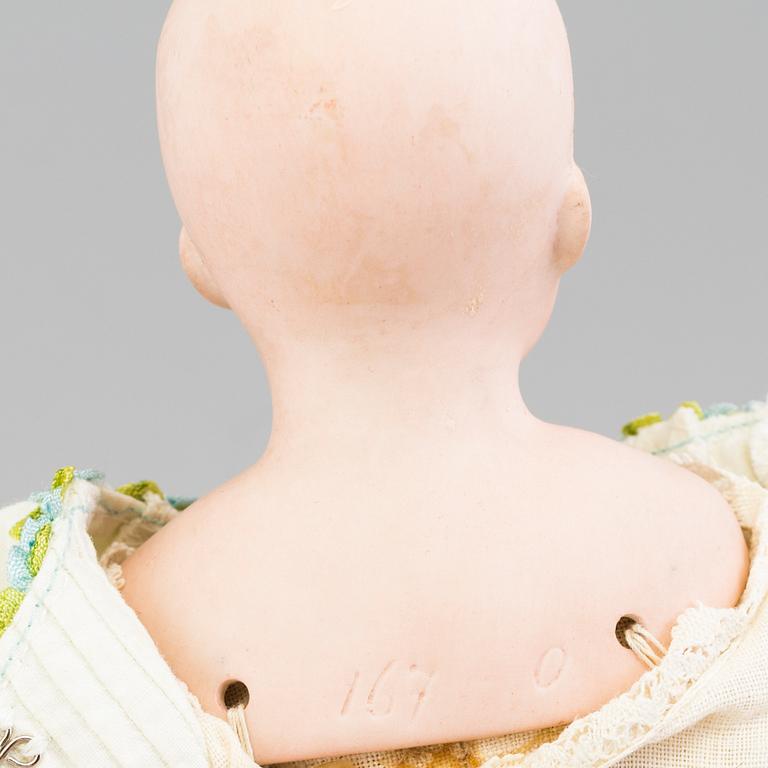 a German porcelain doll from the early 20th century.