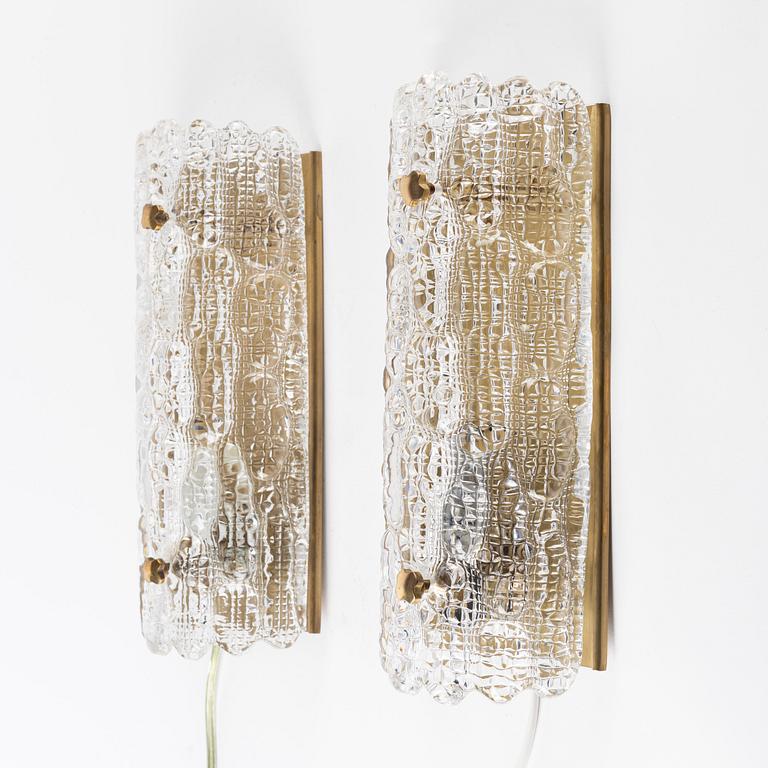 Carl Fagerlund, a pair of glass and brass wall lights, Orrefors, 1960s.