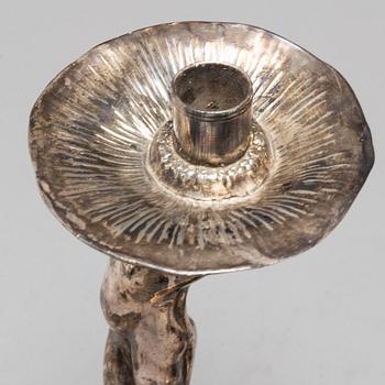 A 20th Century pair of art noveau style candle sticks marked A.W.OX.