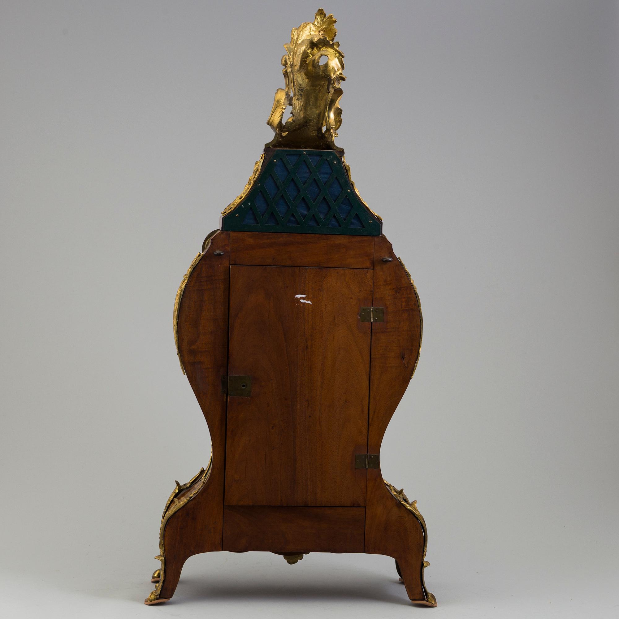 A Rococo/Rococo-style 18th/19th century mantel clock.