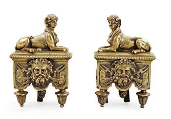1514. A pair of French 19th century bronze fire dogs.