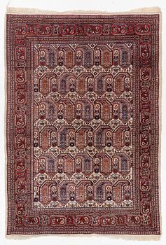 An oriental carpet, approx. 286 x 200 cm.