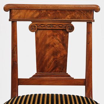 A set of nine Charles X mahogny dining chairs.