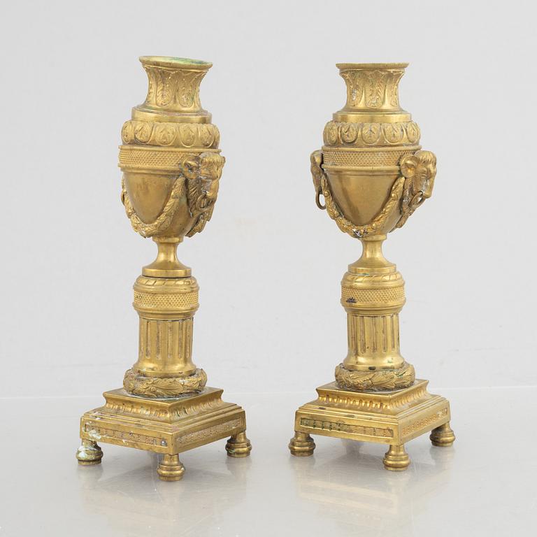 A pair of Louis XVI-style candlesticks, late 19th century.